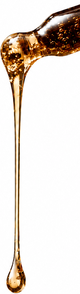 Golden perfume oil dripping from a glass dropper against a pure white background