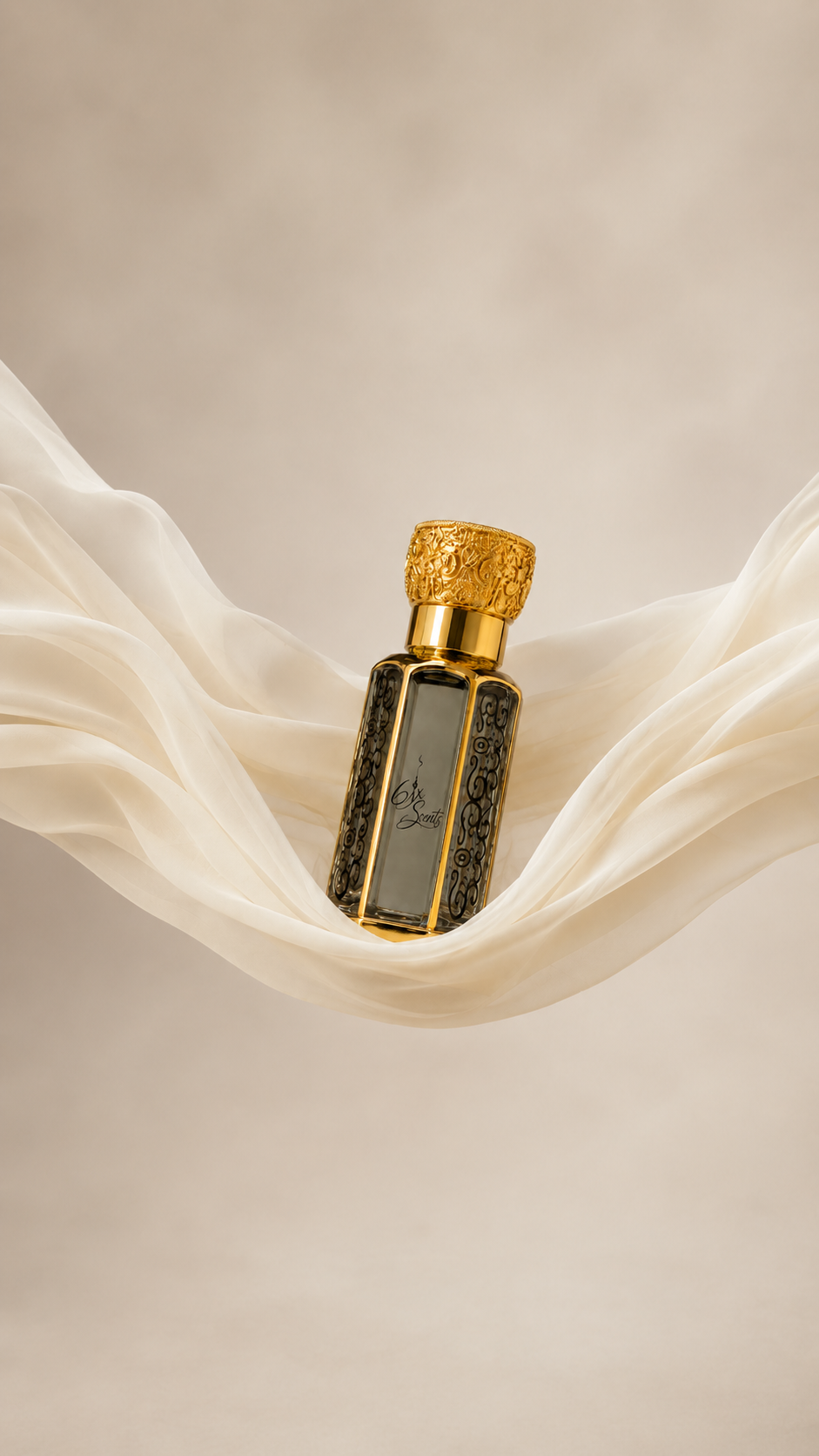 6ix Scents concentrated perfume oil bottle resting on flowing ivory silk